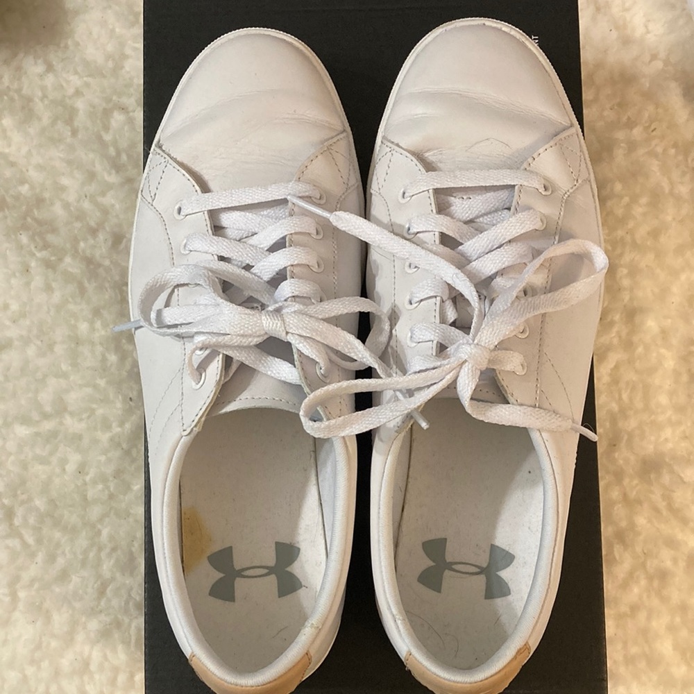 UA white leather sneakers